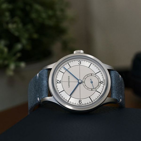 Montre Longines Heritage Classic automatique cadran beige bracelet cuir bleu 38,5 mm L2.828.4.73.2