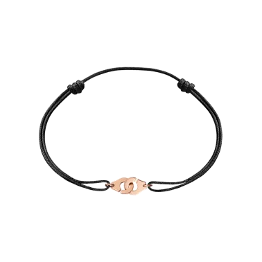 Bracelet Dinh Van Menottes R8 en or rose sur cordon