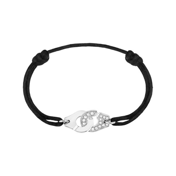 Bracelet Dinh Van Menottes R12 en or blanc et diamants sur cordon