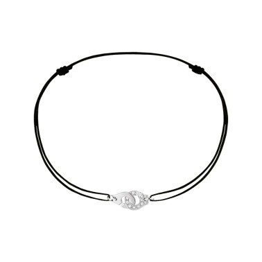 Bracelet Dinh Van Menottes R8 en or blanc et diamants sur cordon