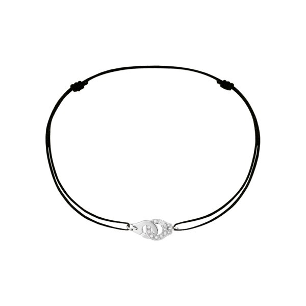 Bracelet Dinh Van Menottes R8 en or blanc et diamants sur cordon