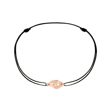 Bracelet Dinh Van Menottes R8 en or rose et diamants sur cordon