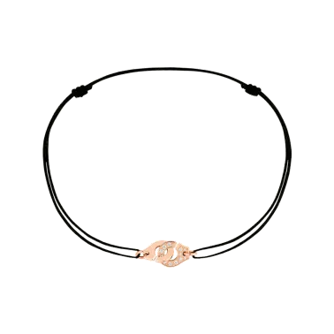 Bracelet Dinh Van Menottes R8 en or rose et diamants sur cordon