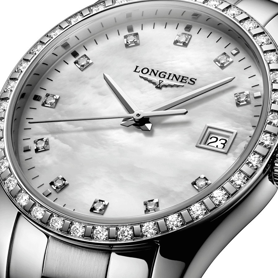 Montre Longines Conquest Classic quartz cadran nacre blanche lunette sertie bracelet acier 34 mm L2.386.0.87.6