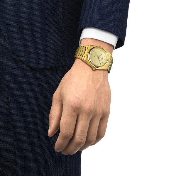 Montre Tissot PRX quartz cadran champagne bracelet acier pvd or jaune 40 mm