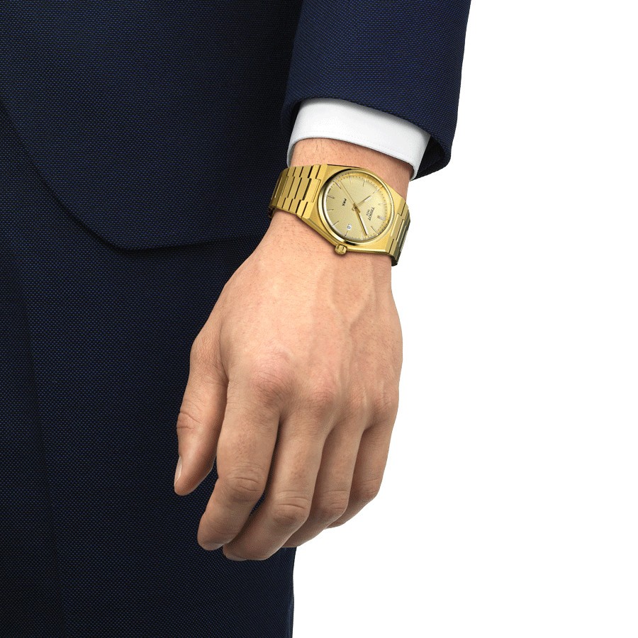 Montre Tissot PRX quartz cadran champagne bracelet acier pvd or jaune 40 mm