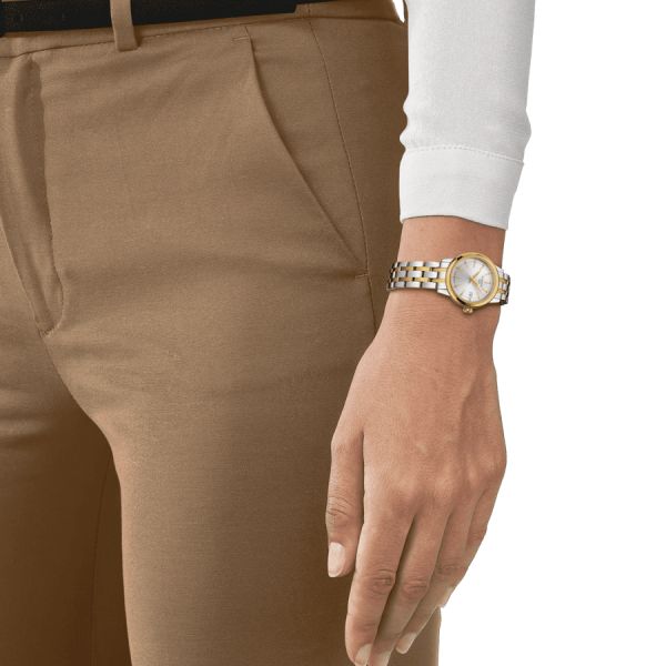 Montre Tissot Classic Dream Lady quartz lunette couleur or jaune cadran argent bracelet acier 28 mm T129.210.22.031.00