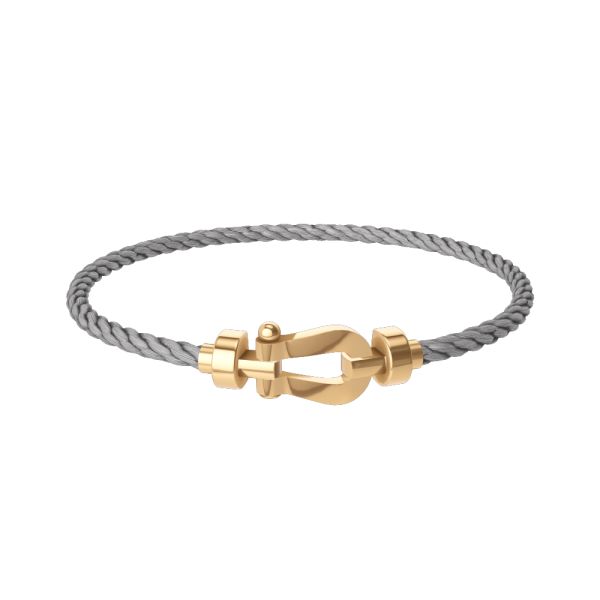 Bracelet Fred Force 10 moyen modèle en or jaune et câble acier