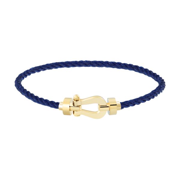 Bracelet Fred Force 10 moyen modèle en or jaune et câble bleu marine