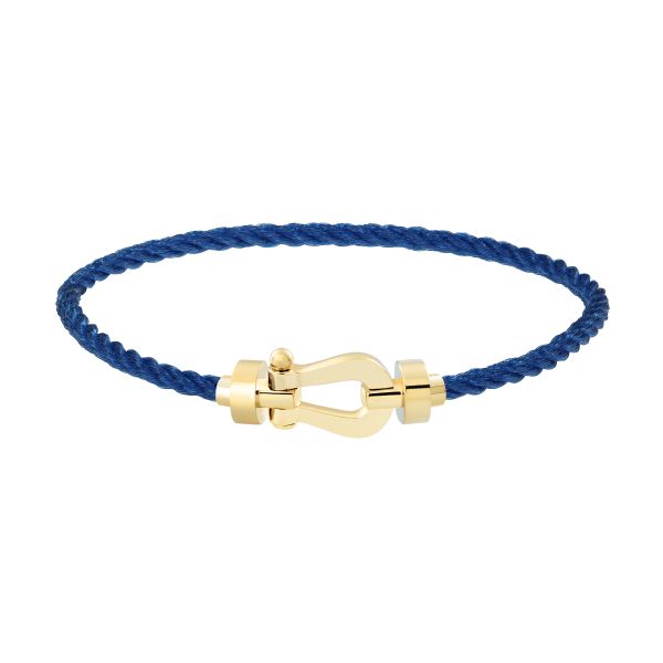 Bracelet Fred Force 10 moyen modèle en or jaune et câble bleu jean