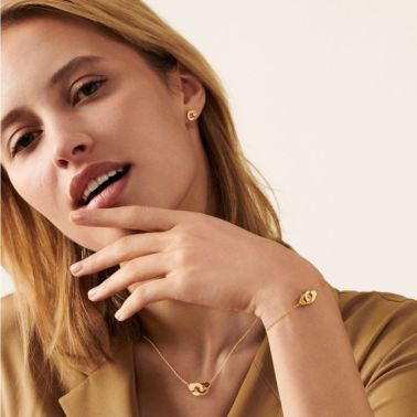 Menottes dinh van R7,5 single earring in yellow gold and diamonds