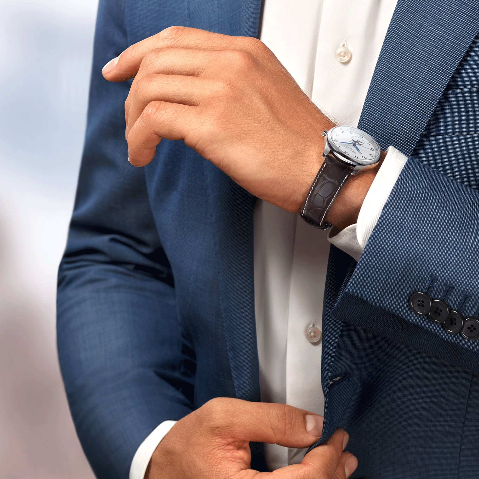 Montre Longines Master Collection automatique cadran argenté phases de lune bracelet cuir brun 42 mm L2.919.4.78.3