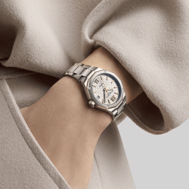 Baume et Mercier Riviera automatic watch gold dial steel bracelet 33 mm