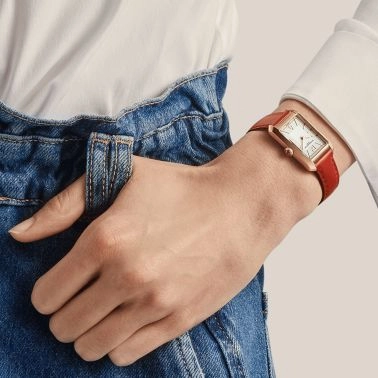 Montre Baume et Mercier Hampton quartz Or rose cadran argenté bracelet cuir orange 35 x 22 mm 10628