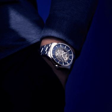 Montre Mido Multifort Skeleton Vertigo automatique cadran squelette bleu bracelet acier 42 mm M038.436.11.041.00