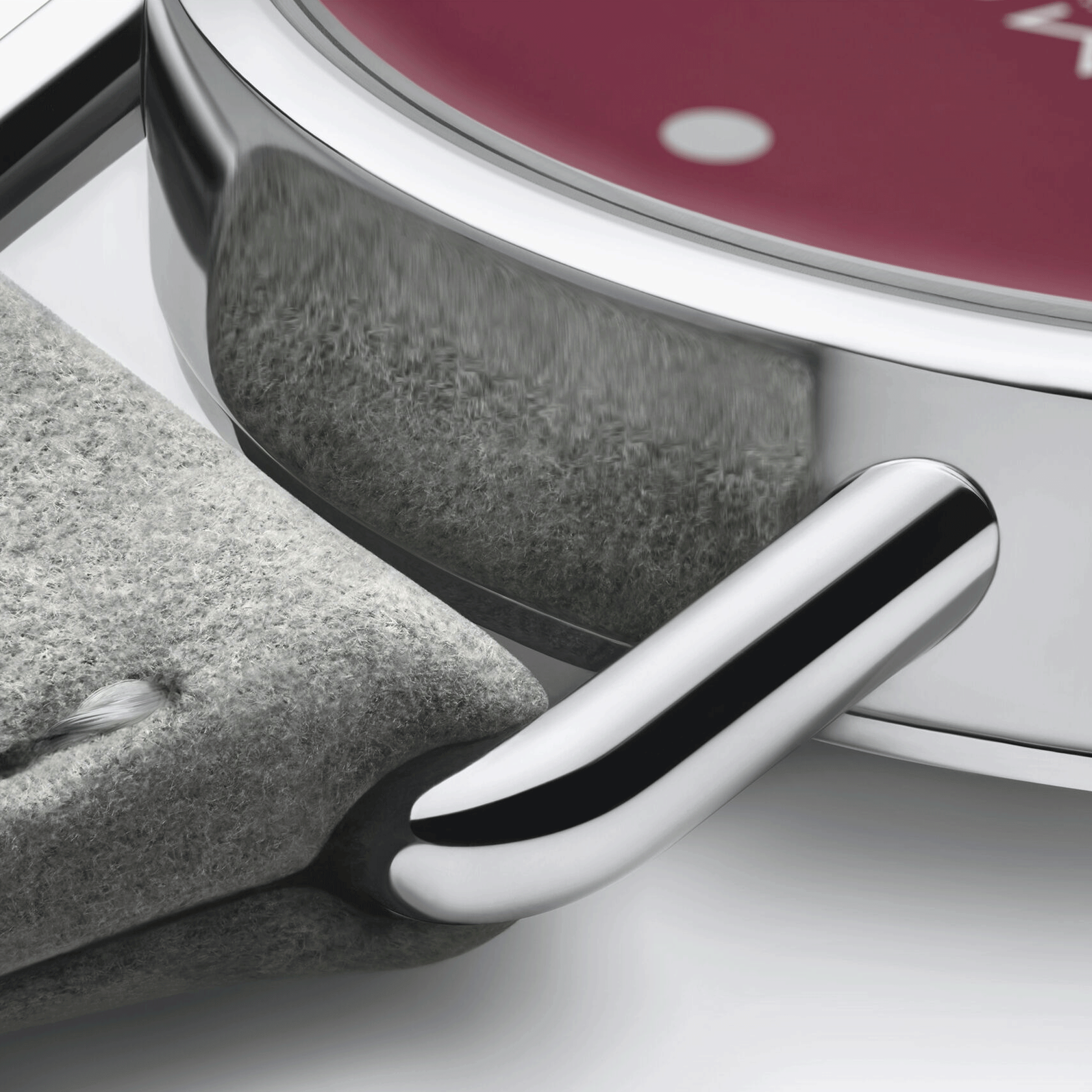 Montre Nomos Metro Muted Red mécanique fond acier cadran rouge bracelet cuir gris 33 mm 1123.SB