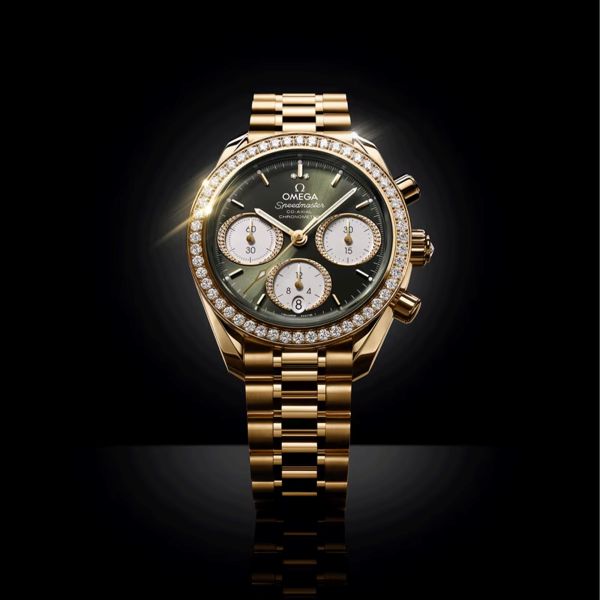 Montre Omega Speedmaster 38 Diamants Chronographe Co-Axial Chronometer automatique Or Moonshine cadran vert bracelet or jaune 38