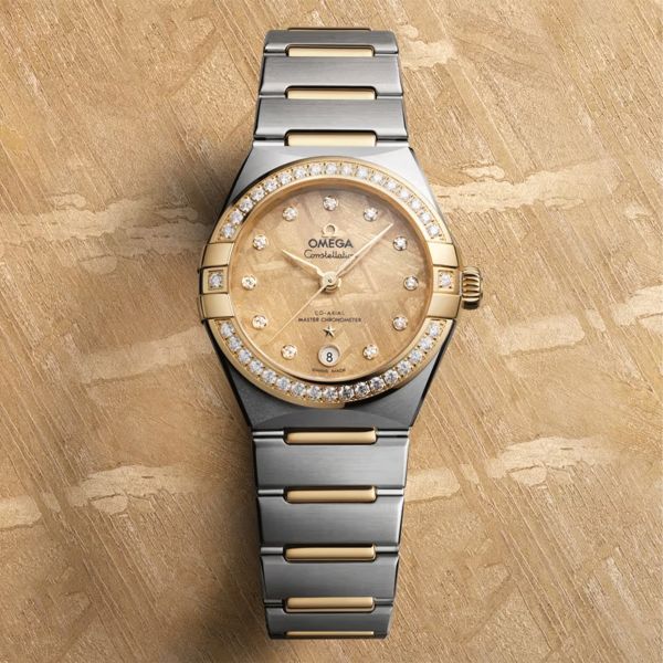 Montre Omega Constellation Météorite automatique or jaune & acier cadran or bracelet acier 29 mm