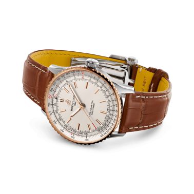 Montre Breitling Navitimer 2024 automatique lunette or rose cadran argent bracelet cuir brun 41 mm U17329F41G1P1