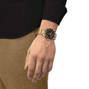 Montre Tissot Seastar 1000 GMT PVD Or Jaune quartz lunette noire et marron cadran noir 40 mm T120.852.22.051.00