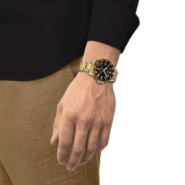 Montre Tissot Seastar 1000 GMT PVD Or Jaune quartz lunette noire et marron cadran noir 40 mm T120.852.22.051.00