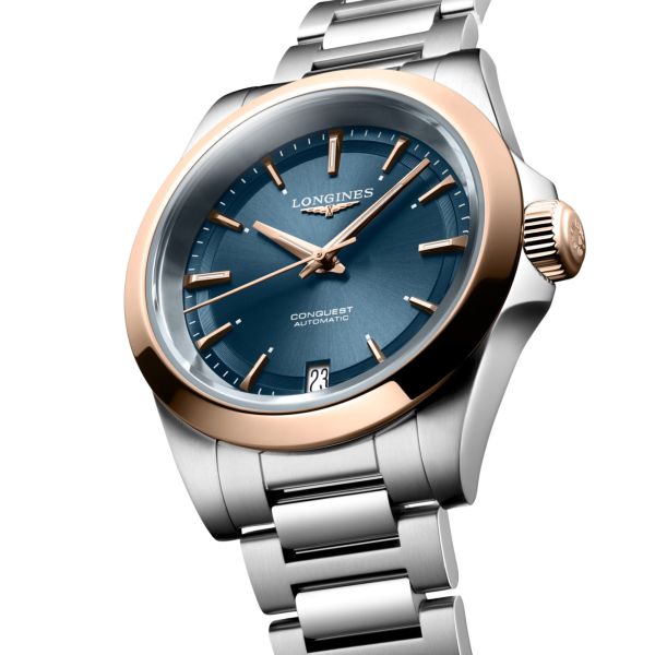 Montre Longines Conquest Or rose automatique cadran bleu bracelet acier et or rose 34 mm
