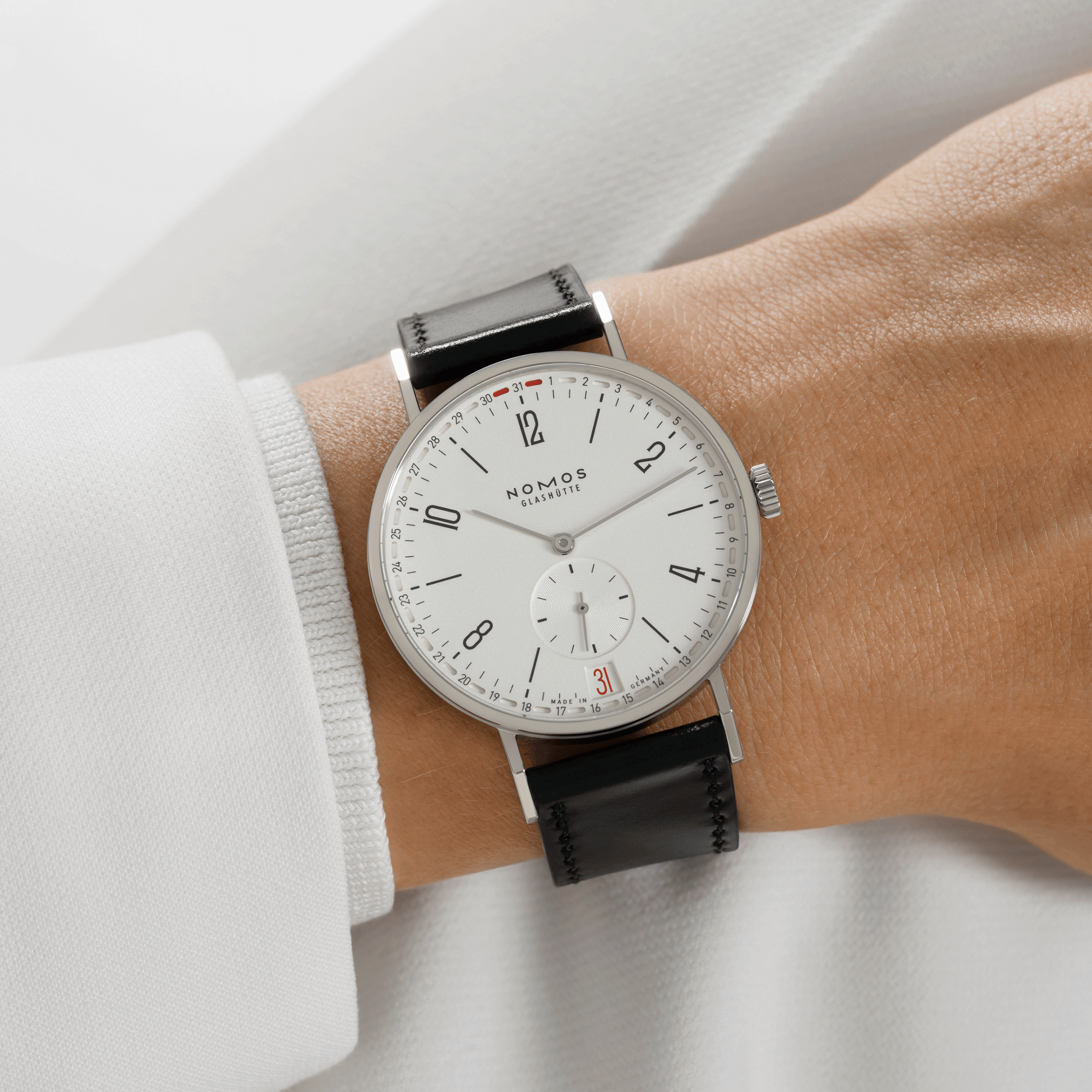 NOMOS Tangente 2date silver-white dial manual-wind black leather strap sapphire crystal back 37,5 mm