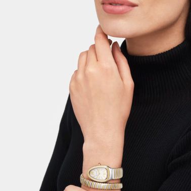 Montre Bulgari Serpenti Tubogas quartz lunette sertie cadran blanc opalin bracelet acier et or jaune 35 mm 103648