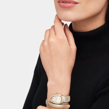 Montre Bulgari Serpenti Tubogas quartz lunette sertie cadran blanc opalin bracelet acier et or jaune 35 mm 103648