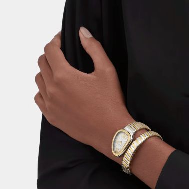 Montre Bulgari Serpenti Tubogas quartz lunette sertie cadran blanc opalin bracelet acier et or jaune 35 mm 103648