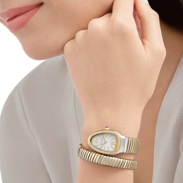 Montre Bulgari Serpenti Tubogas quartz lunette sertie cadran blanc opalin bracelet acier et or jaune 35 mm 103648