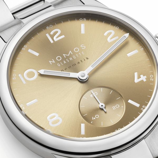 Nomos Club Sport Neomatik 34 Gold automatic sapphire back golden dial steel bracelet 34 mm