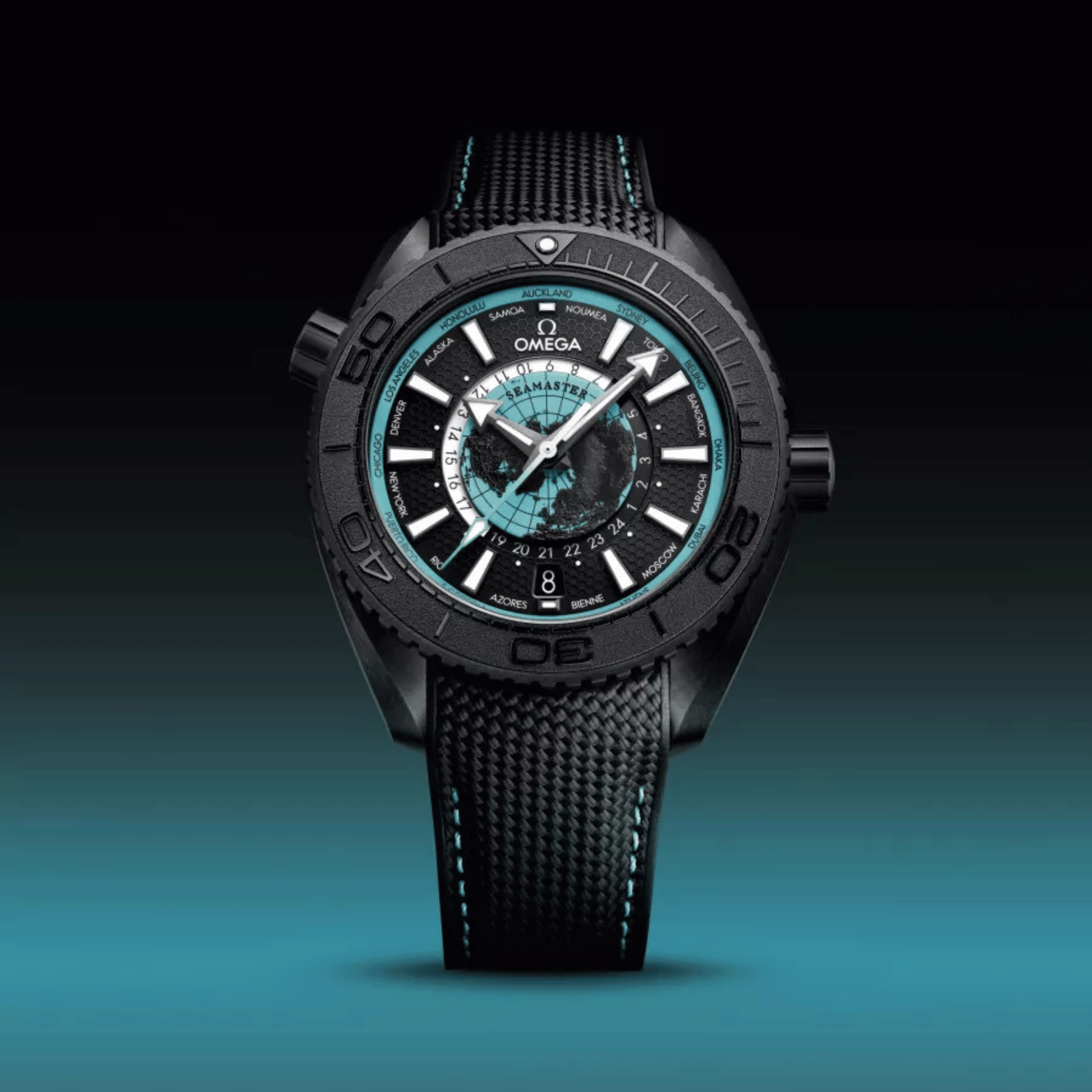 Montre Omega Seamaster Planet Ocean 600M Worldtimer céramique noire cadran turquoise bracelet caoutchouc 45,5 mm