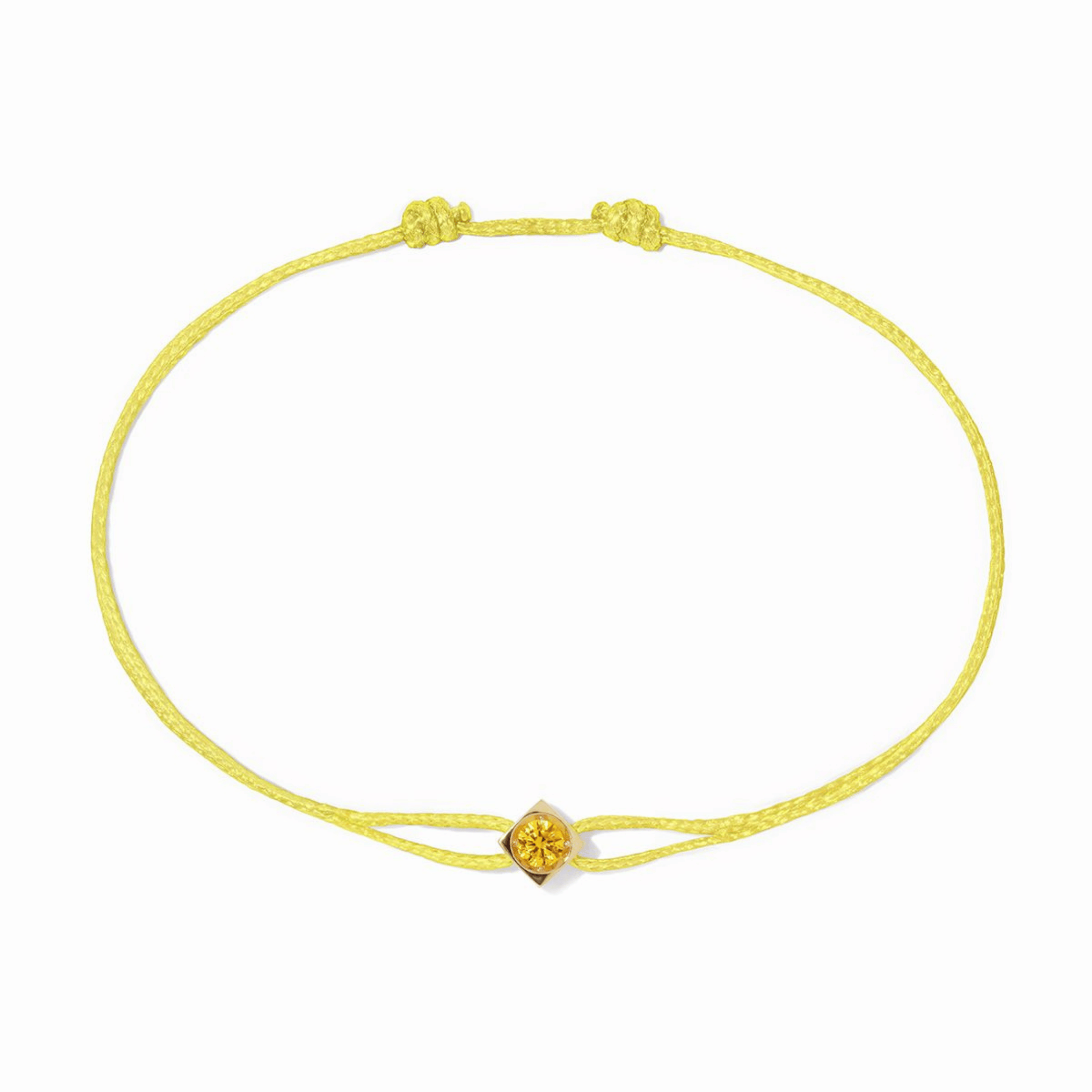 Bracelet dinh van Le Cube or jaune et saphir jaune sur cordon