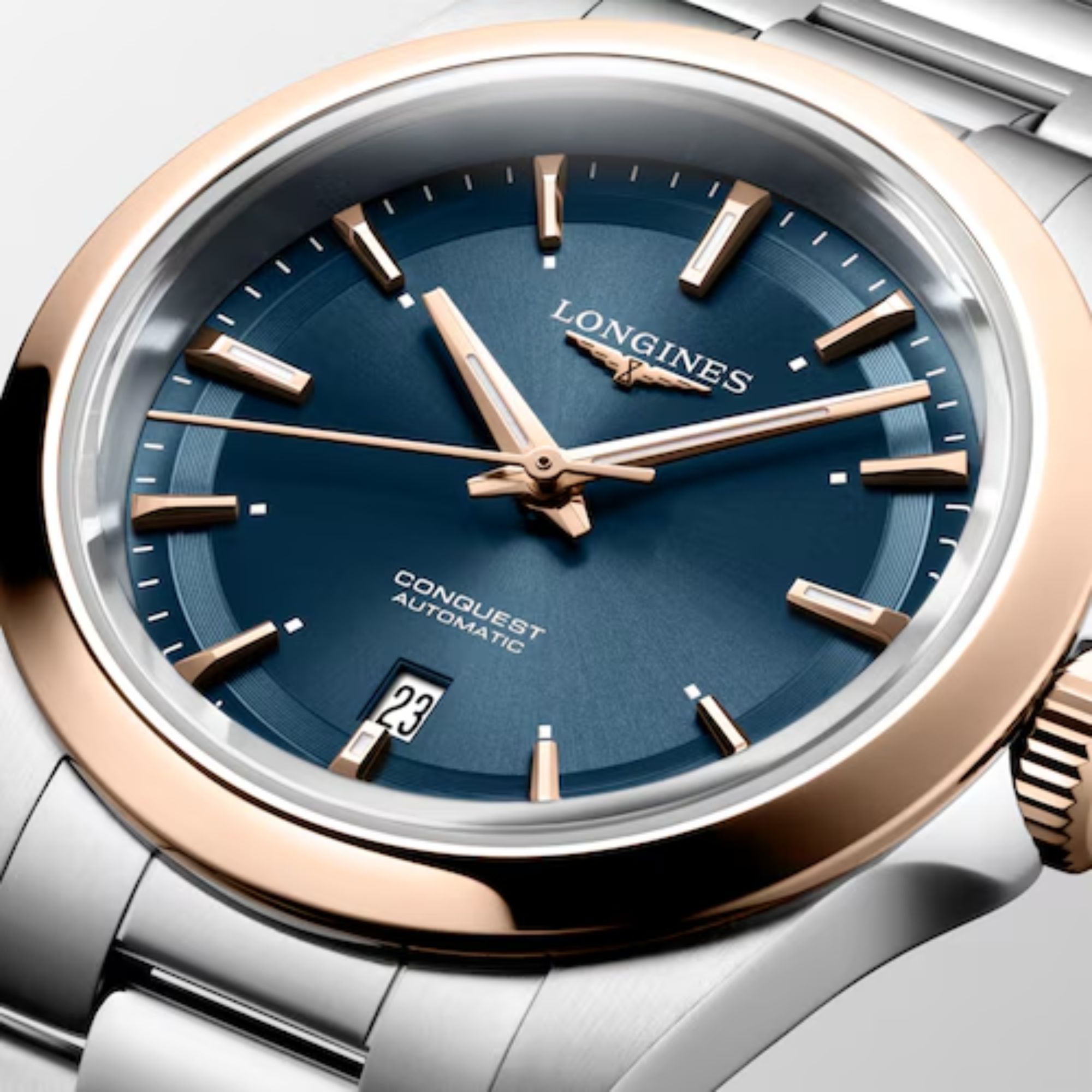 Montre Longines Conquest Or rose automatique cadran bleu bracelet caoutchouc acier 30 mm