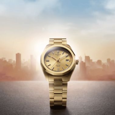 Montre Tissot T-Classic PRC 100 Solar quartz solaire PVD or jaune cadran champagne glacier bracelet acier 34 mm