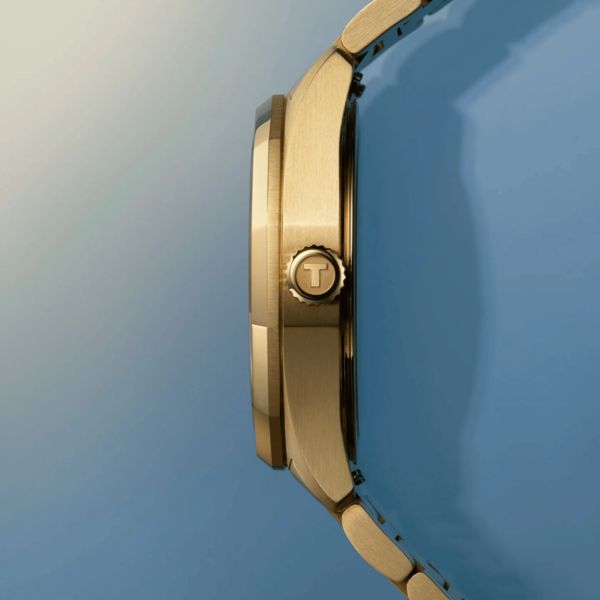 Montre Tissot T-Classic PRC 100 Solar quartz solaire PVD or jaune cadran champagne glacier bracelet acier 34 mm