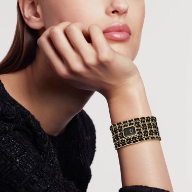 Montre CHANEL Première Manchette Edition Originale quartz cadran laqué noir bracelet acier or jaune et cuir noir 15,2 mm