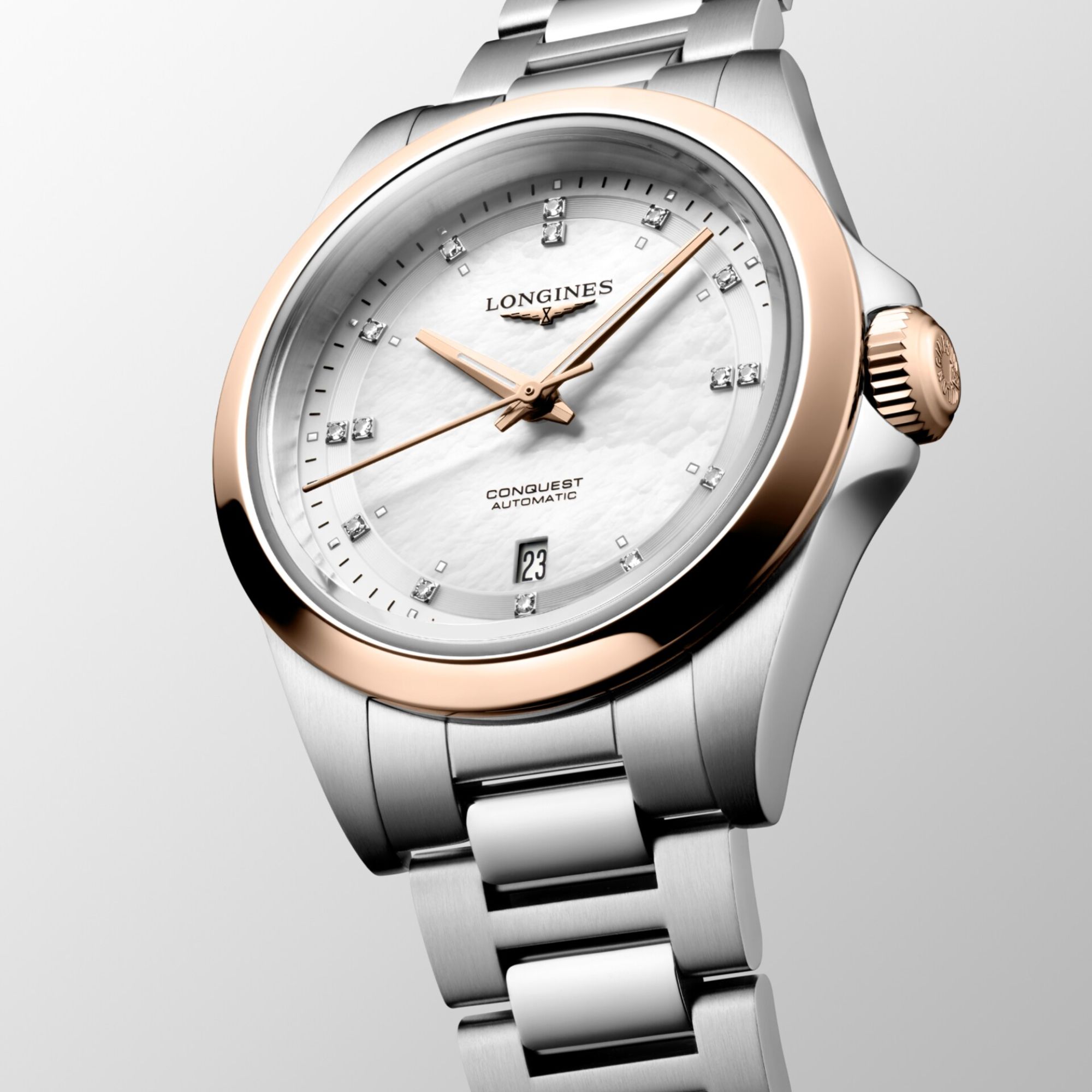 Montre Longines Conquest automatique cadran nacre blanche lunette or rose bracelet acier et or rose 30 mm