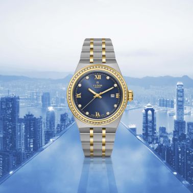Montre Tudor Royal automatique lunette sertie diamants index diamants cadran bleu bracelet acier et or jaune 28 mm