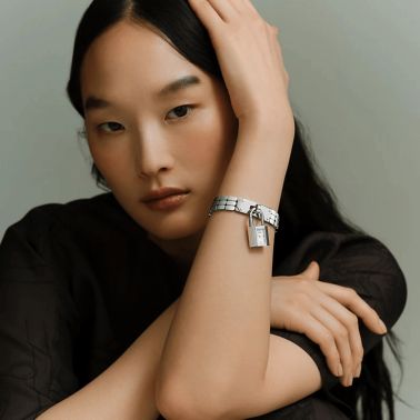 Montre HERMÈS Kelly Mini Modèle quartz cadran laqué blanc bracelet acier 16 mm