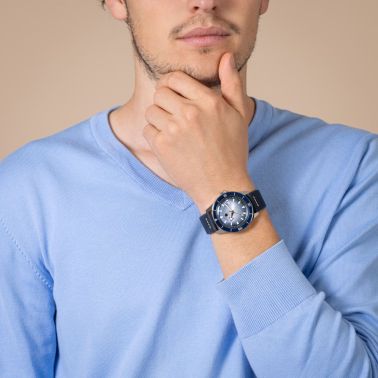 Rado Captain Cook automatic watch with blue dial, stainless steel bracelet, blue leather strap, and blue and white fabric strap,