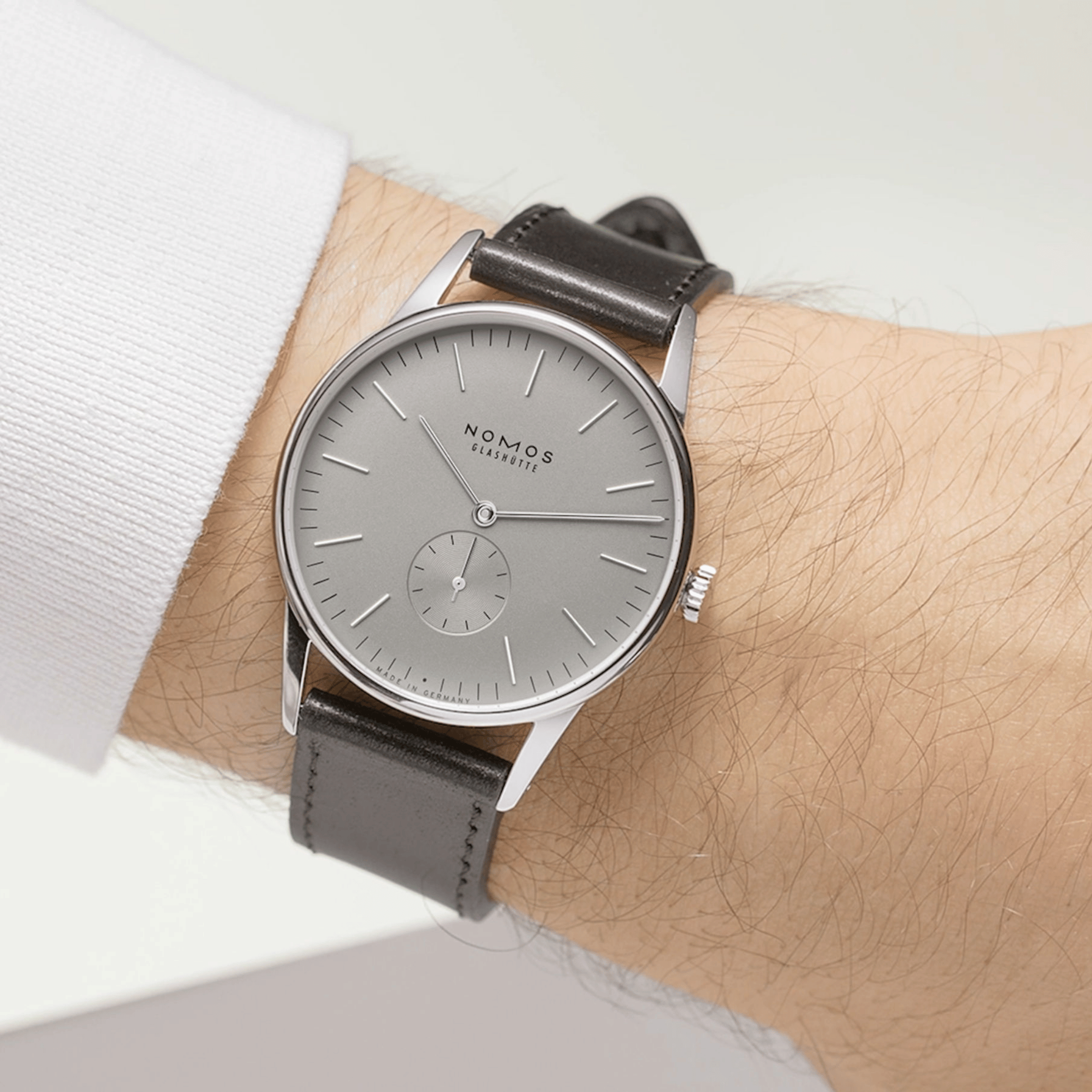NOMOS Orion 38 Gray mechanical open caseback grey dial black leather strap 38 mm