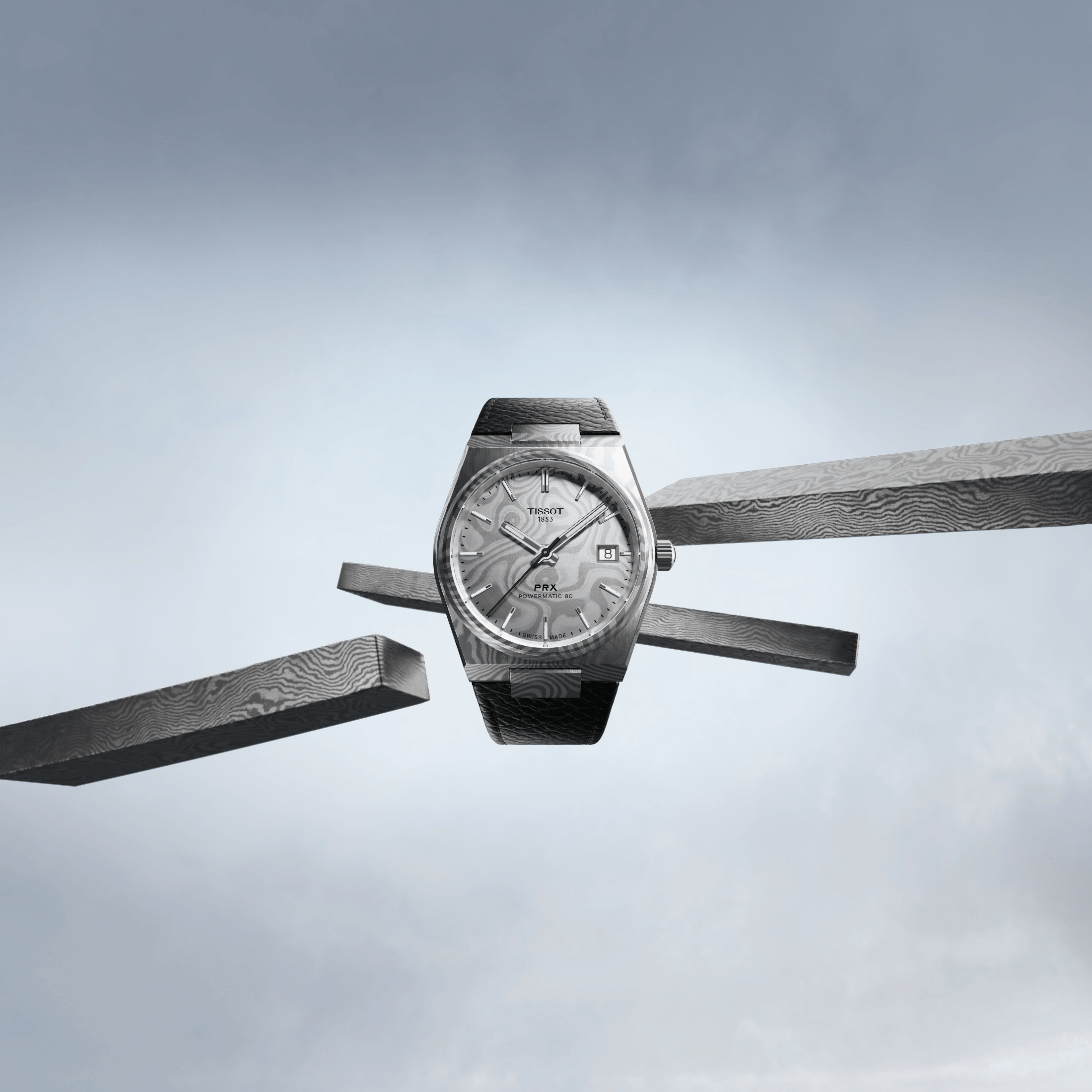 Montre Tissot PRX Damas Powermatic 80 cadran acier damas bracelet cuir 38 mm