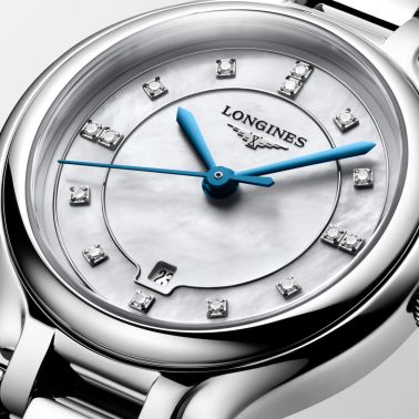 Longines PrimaLuna quartz watch with white mother-of-pearl dial, diamond hour markers, and 30 mm steel bracelet